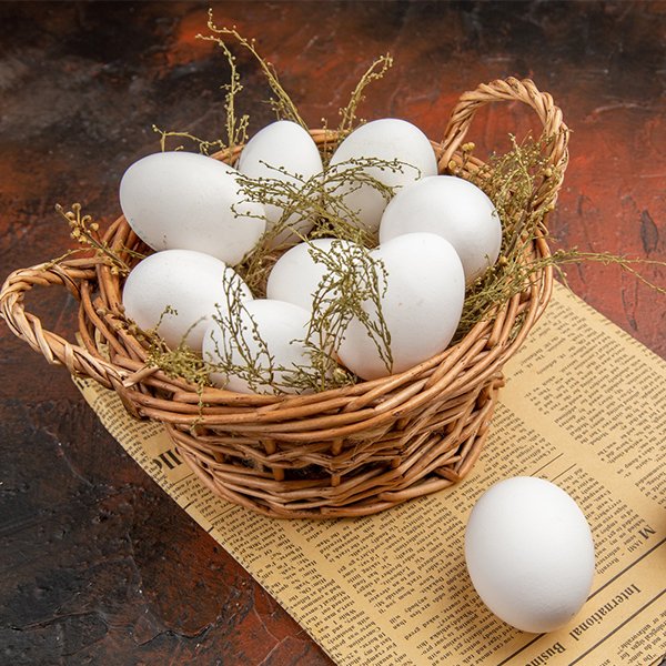 Fresh pasture-raised eggs in a basket from Good Food Farm